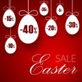 Easter sale banner. Easter hanging eggs, cartoon ribbon bow, red background. Tag template for holiday Easter decoration Royalty Free Stock Photo