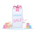Easter sale banner on mobile phone with gift and shopping bag Royalty Free Stock Photo
