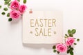 Easter sale message with roses and leaves