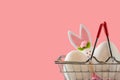 Easter scene with colored eggs, easter bunny,, pink background