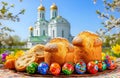 Easter, Easter cakes, and painted eggs against the backdrop of a church Royalty Free Stock Photo