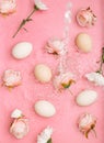 Easter scene with rose flowers and eggs in water with bubbles. Minimal natural pastel pink background Royalty Free Stock Photo