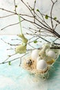 Easter scene with spring fresh greenery branches, rabbit and nest of eggs, springtime festive background.