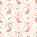 Easter seamless pattern with coral decorated eggs, bows and adorable rabbits. Spring details on beige background. Royalty Free Stock Photo