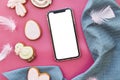 Easter seasonal aesthetics pastry and mockup of screen phone on pink background flat lay. Happy Easter