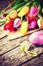 Easter setting with multicolor tulips Royalty Free Stock Photo