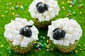 Easter sheep cupcakes on green grass background Royalty Free Stock Photo