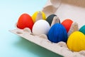 Easter shopping concept. Close-up of hand-painted Easter eggs in a cardboard egg box. Happy Easter concept Royalty Free Stock Photo