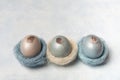 Easter, silver, blue eggs on a gray concrete background