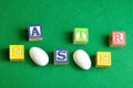 Easter spelled with colorful alphabet blocks and eggs Royalty Free Stock Photo
