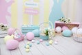 Easter and spring decor. Large multi-colored eggs and Easter bunny. Royalty Free Stock Photo