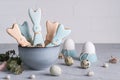 Easter spring decorative composition with homemade easter cookies in the shape of a funny rabbit, quail eggs .On a gray concre Royalty Free Stock Photo