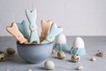 Easter spring decorative composition with homemade easter cookies in the shape of a funny rabbit, quail eggs . Royalty Free Stock Photo