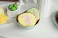 Easter spring decorative composition with homemade easter cookies in the shape of a funny rabbit, quail eggs. Royalty Free Stock Photo