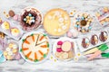 Easter or spring dessert food table scene. Overhead view on a white wood background. Royalty Free Stock Photo