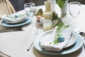 Easter and spring festive table decorated in blue and white tones in natural rustic style, with eggs, bunny, fresh flowers Royalty Free Stock Photo