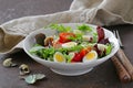 Easter Spring salad with quail eggs, tomatoes Royalty Free Stock Photo