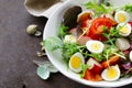 Easter Spring salad with quail eggs, tomatoes Royalty Free Stock Photo