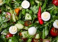 Easter Spring salad with quail eggs, tomatoes and cucumbers Royalty Free Stock Photo