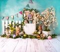 Easter spring sett up with colourful flowers pink flowers,bunny and easter eggs and vintage wood parquet