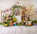 Easter spring sett up with colourful flowers pink and yellow flowers,bunny and easter eggs and vintage wood parquet Royalty Free Stock Photo