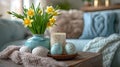 Easter still life, candle, Easter eggs and a vase with spring flowers daffodils on a table in the room, beige and blue Royalty Free Stock Photo