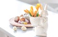 Easter still life with a ceramic hare, eggs and flowers. Royalty Free Stock Photo