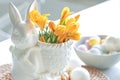 Easter still life with a ceramic hare, eggs and flowers. Royalty Free Stock Photo