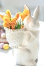 Easter still life with a ceramic hare, eggs and flowers. Royalty Free Stock Photo