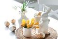 Easter still life with a ceramic hare, eggs and flowers. Royalty Free Stock Photo