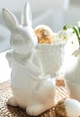Easter still life with a ceramic hare, eggs and flowers. Royalty Free Stock Photo