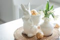 Easter still life with a ceramic hare, eggs and flowers. Royalty Free Stock Photo