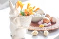 Easter still life with a ceramic hare, eggs and flowers. Royalty Free Stock Photo