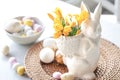 Easter still life with a ceramic hare, eggs and flowers. Royalty Free Stock Photo