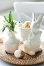 Easter still life with a ceramic hare, eggs and flowers. Royalty Free Stock Photo