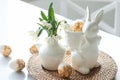 Easter still life with a ceramic hare, eggs and flowers. Royalty Free Stock Photo