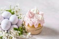 Easter still life. Traditional pastries, painted eggs and white cherry flowers Royalty Free Stock Photo