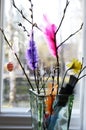 Easter still life, willow branch and feathers in a vase Royalty Free Stock Photo