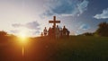 Silhouette family looking for the cross of Jesus Christ on autumn sunrise background. 3d rendering Royalty Free Stock Photo