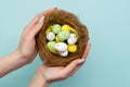 easter symbol festive gift hands color eggs nest Royalty Free Stock Photo