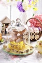 Easter table decoration with kissing bunnies in glass cloche