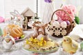 Easter table decoration with kissing bunny figurines on the plate