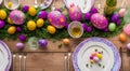 Easter table place setting decoration with colorful eggs. Traditional Easter treats on festive table decorated with spring flowers