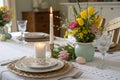 Easter table setting with candle and flowers Royalty Free Stock Photo