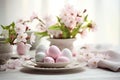Easter table setting composition with colored eggs,light dishes and delicate apple blossoms, the concept of Easter design and