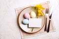 Easter laying table appointments, table setting options. Silverware, tableware items with festive decoration. Fork, knife and flow Royalty Free Stock Photo