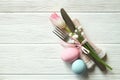 Easter laying table appointments, table setting options. Silverware, tableware items with festive decoration. Fork, knife and flow Royalty Free Stock Photo