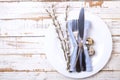 Easter laying table appointments, table setting options. Silverware, tableware items with festive decoration. Fork, knife and flow Royalty Free Stock Photo