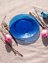 Easter table setting empty blue glass plate cutlery tree branches linen cloth flat lay harsh shadow Festive dish place Royalty Free Stock Photo