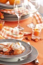 Easter table setting in orange tones Royalty Free Stock Photo